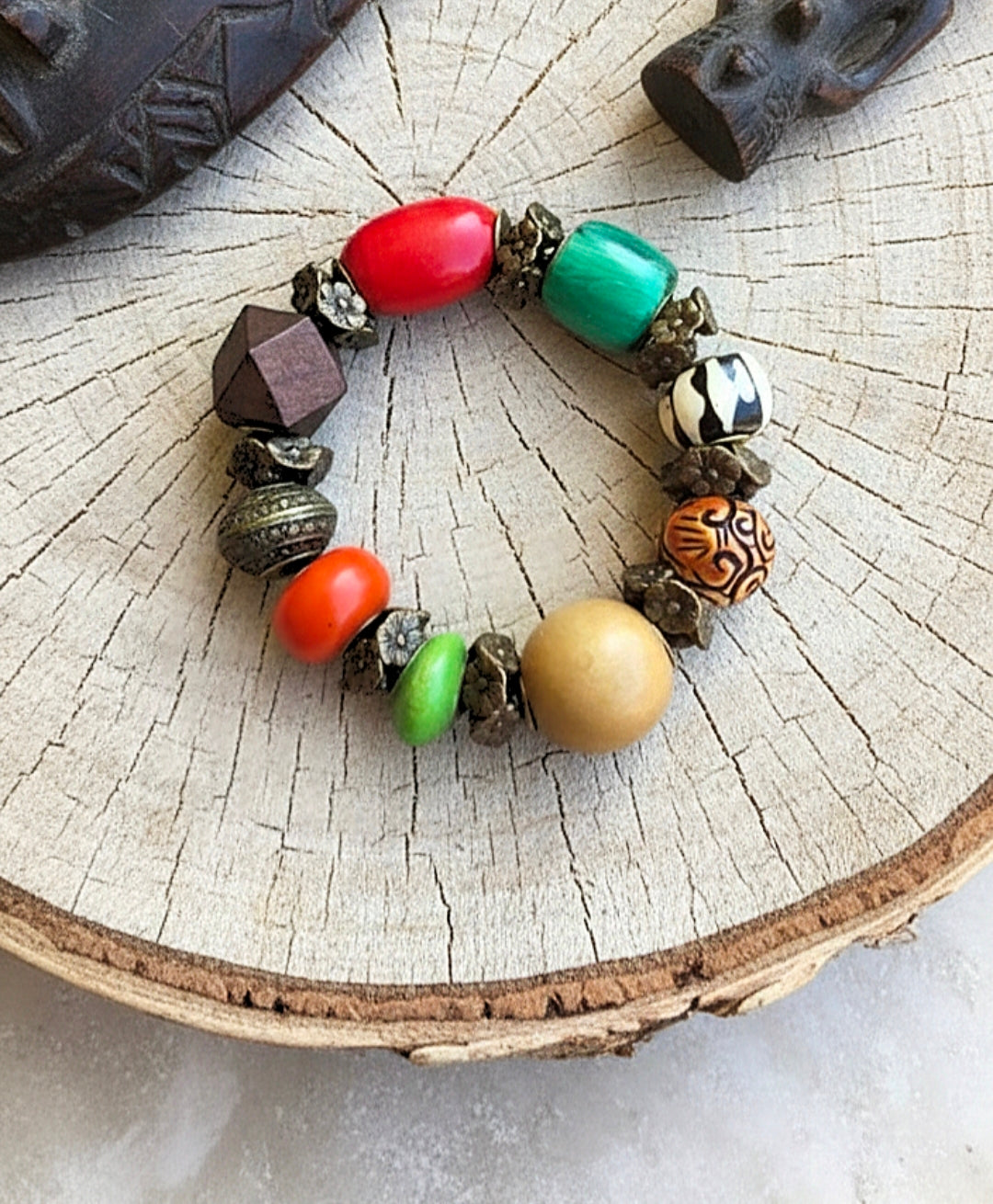 Colorful beaded bracelet on a wooden surface