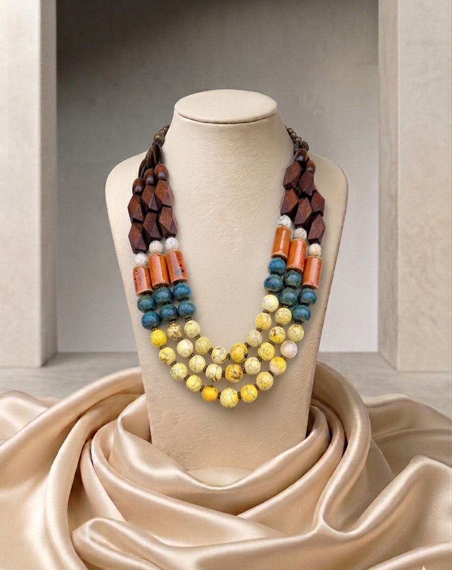 Colorful beaded necklace on a mannequin bust with a beige fabric background