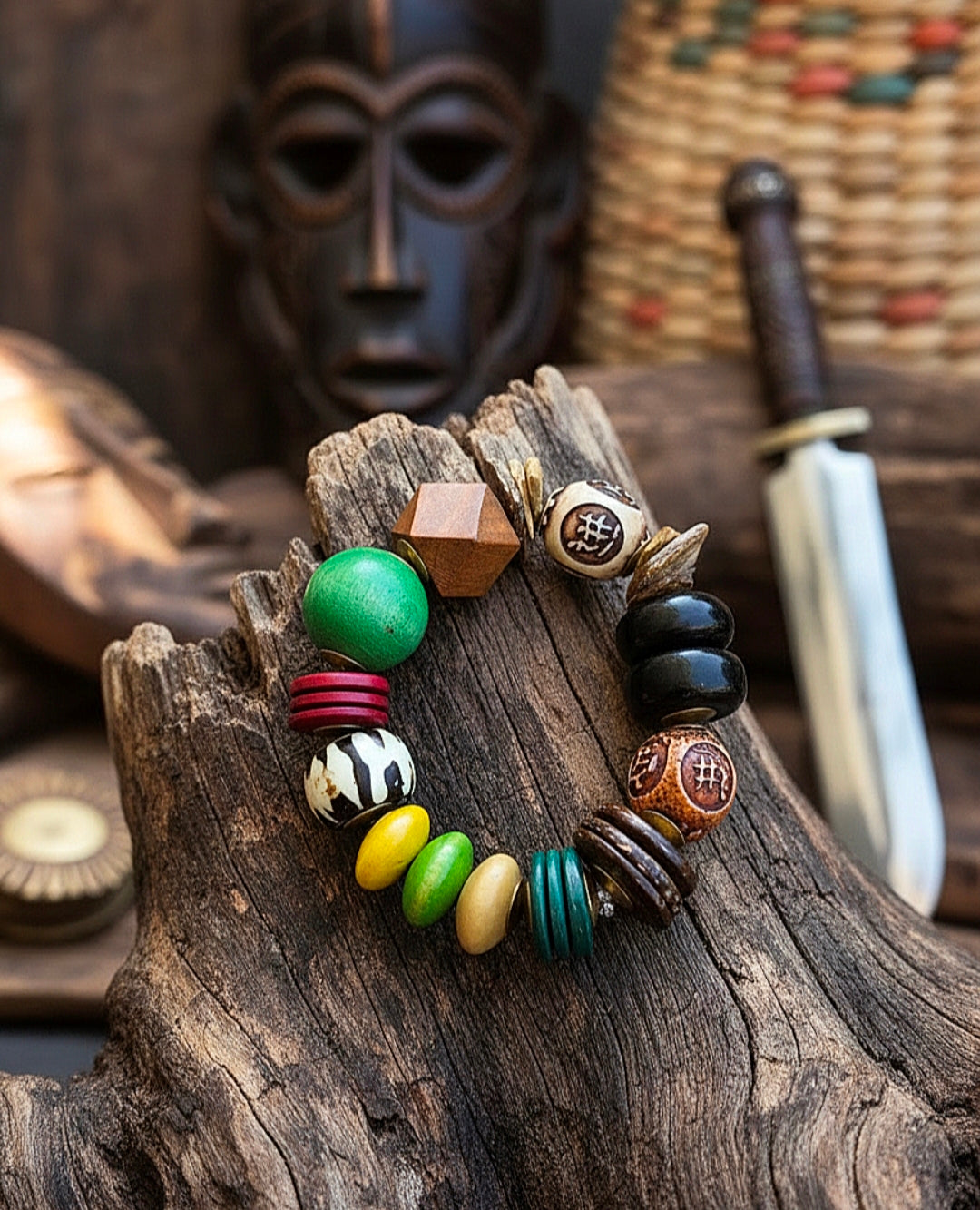 Colorful beaded bracelet on a wooden surface with a mask and sword in the background