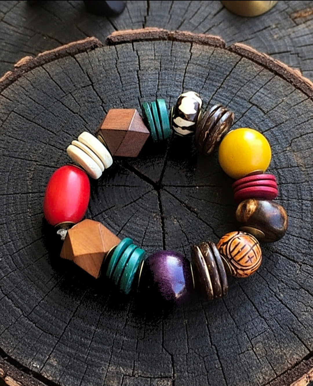 Colorful beaded bracelet on a wooden surface