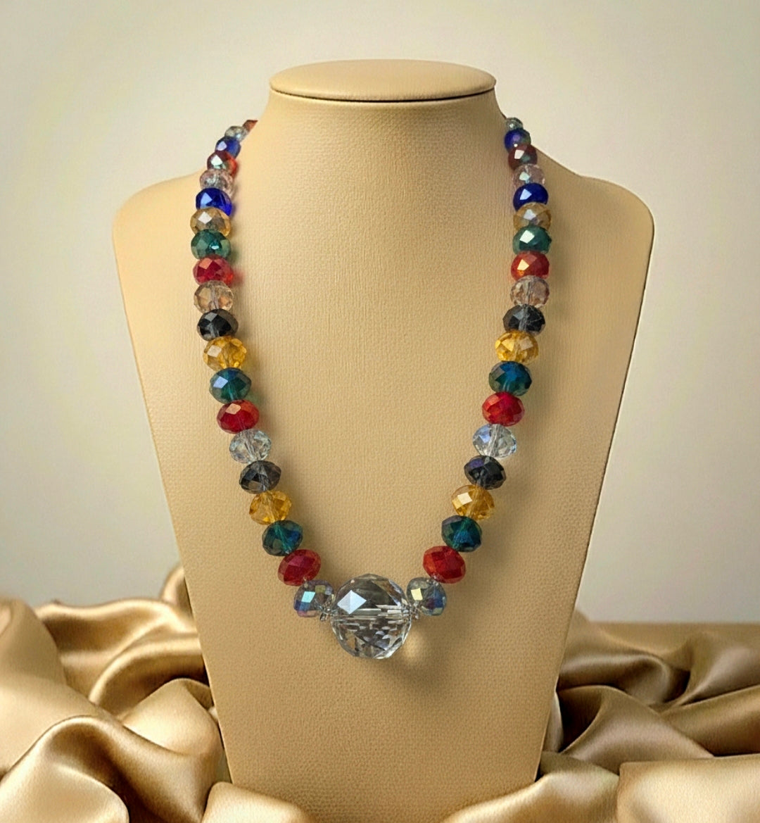 Colorful beaded crystal necklace on a mannequin bust with a beige background