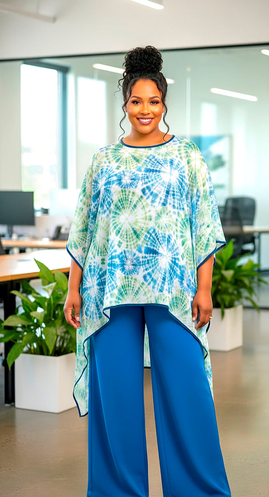 Woman wearing a tie-dye shirt and blue pants in an office setting