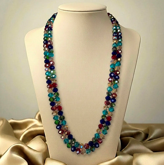 Multicolored beaded crystal necklace on a mannequin bust with a beige background