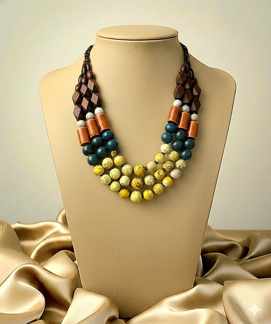Multicolored beaded necklace on a mannequin bust with a beige background