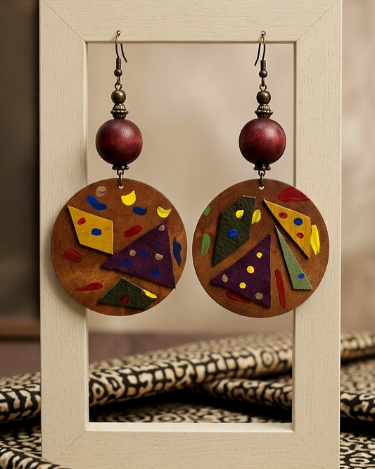 Honey Colored round wood earrings with leather and paint strokes
