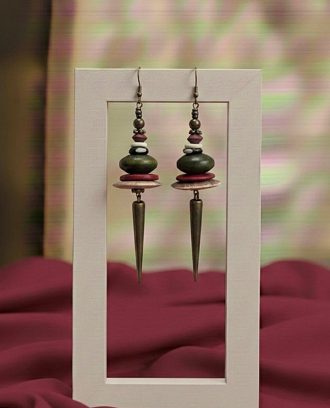 Pair of earrings with a geometric design on a framed background